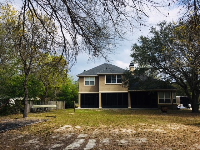 96525 Chester Road Yulee, FL 32097 - Photo 35 of 35 a front view of a house with a garden