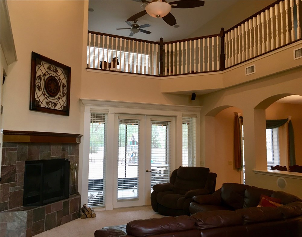 96525 Chester Road Yulee, FL 32097 - Photo 5 of 35 a living room with furniture fireplace and flat screen tv
