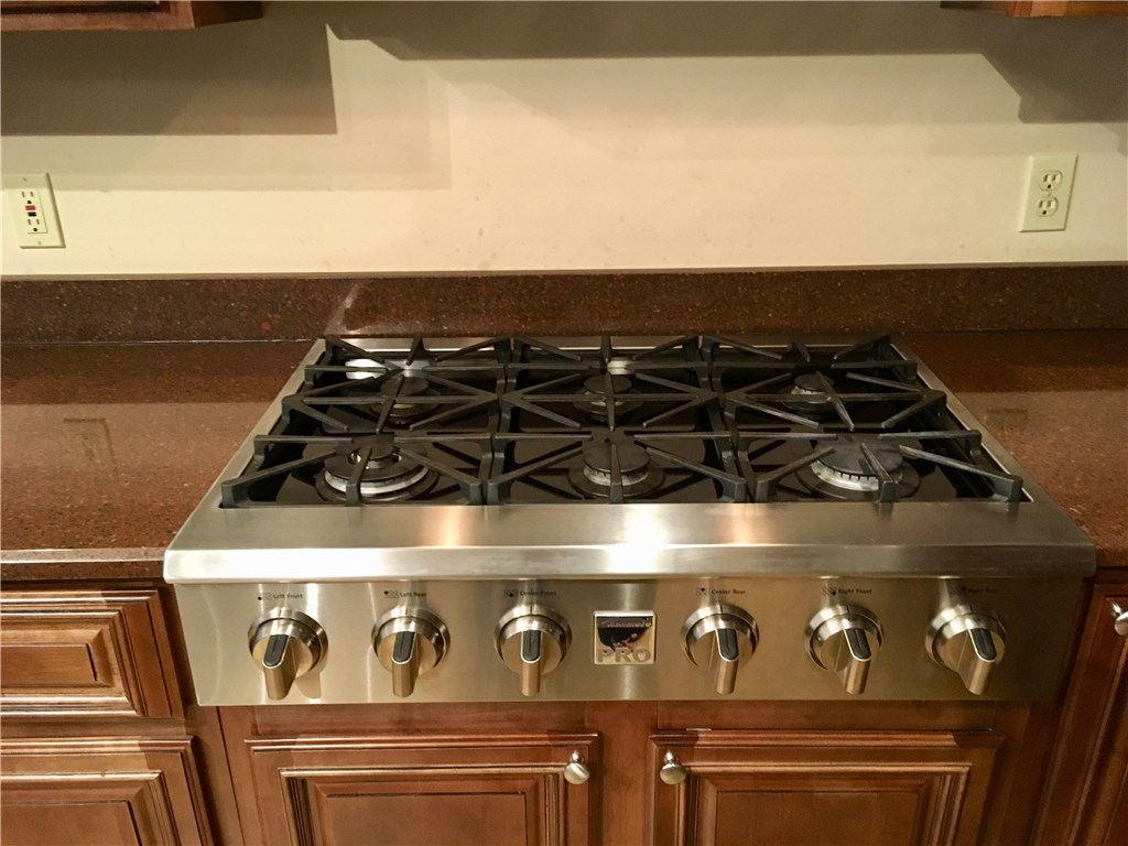 96525 Chester Road Yulee, FL 32097 - Photo 10 of 35 a close up of a stove top oven sitting inside of a kitchen