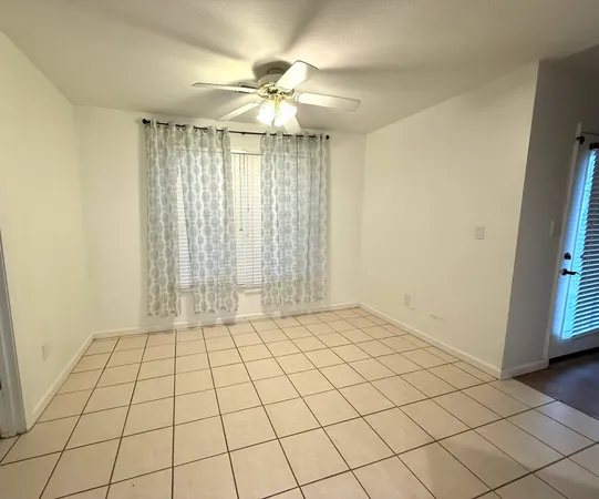 a view of an empty room and window