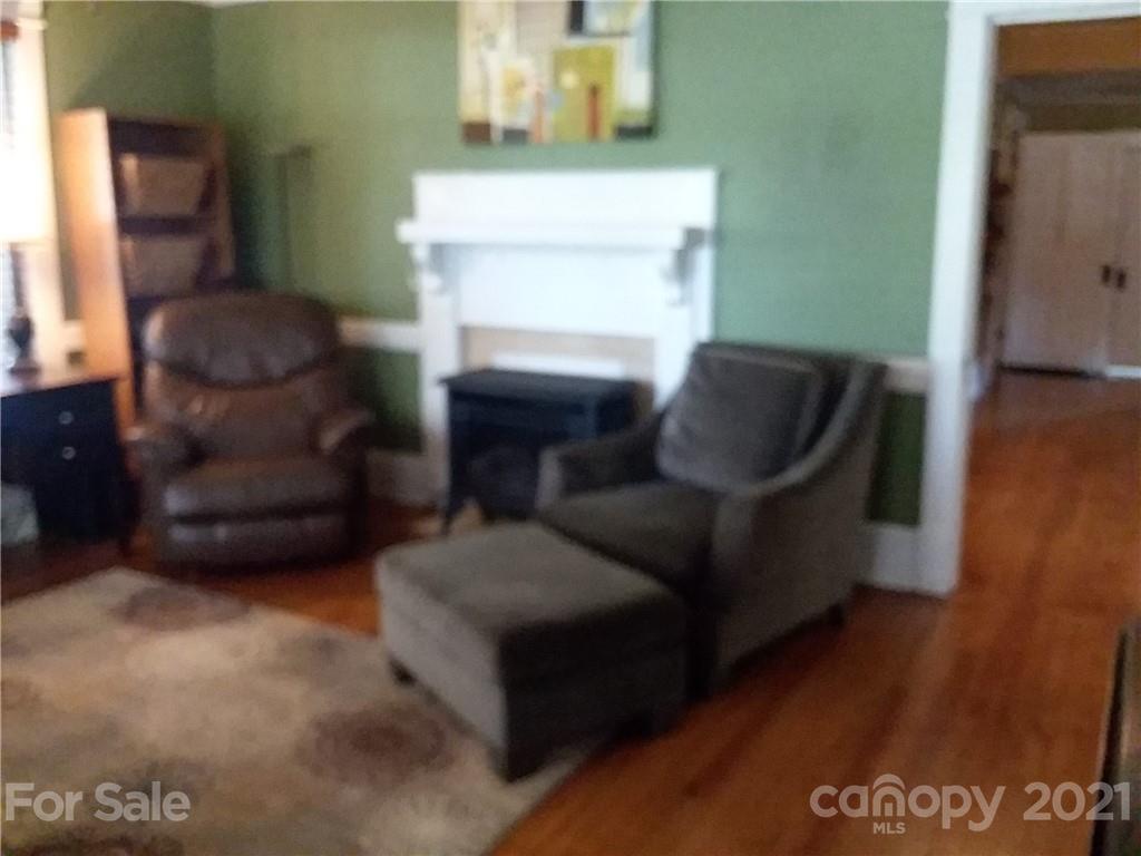 55 Hunter Bridge Road Stony Point, NC 28678 - Photo 12 of 32 a living room with furniture and a fireplace