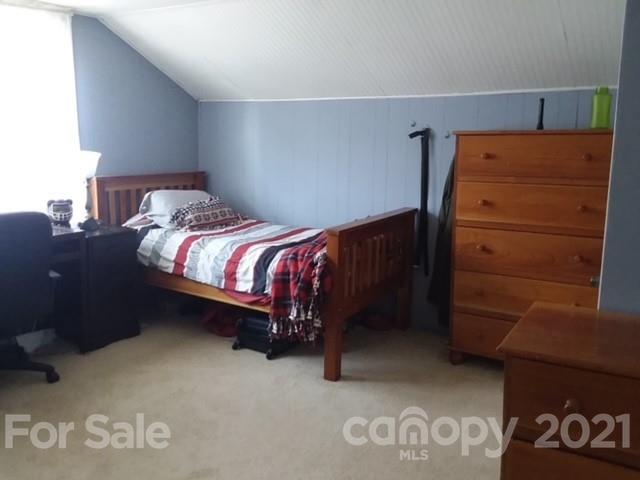 55 Hunter Bridge Road Stony Point, NC 28678 - Photo 24 of 32 a bed sitting in a bedroom next to a window