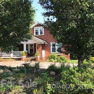 55 Hunter Bridge Road Stony Point, NC 28678 - Photo 5 of 32 a front view of a house with yard and green space