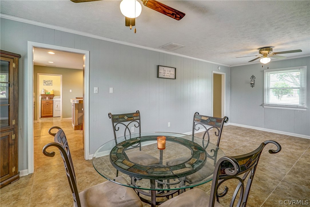10601 River Road Chesterfield, VA 23838 - Photo 12 of 39 a dining room with furniture and a chandelier