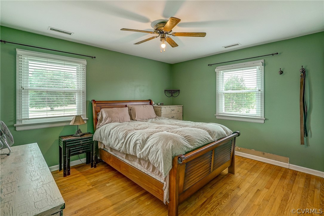 10601 River Road Chesterfield, VA 23838 - Photo 14 of 39 a bed sitting in a bedroom next to a window