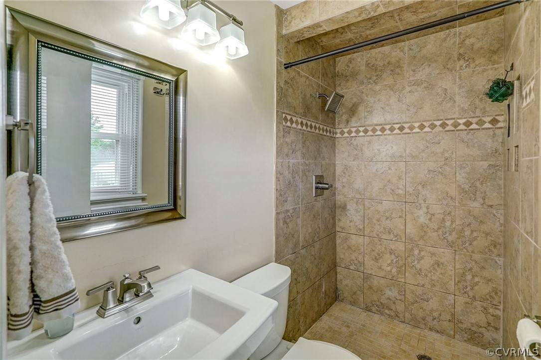 10601 River Road Chesterfield, VA 23838 - Photo 17 of 39 a bathroom with a sink mirror and shower