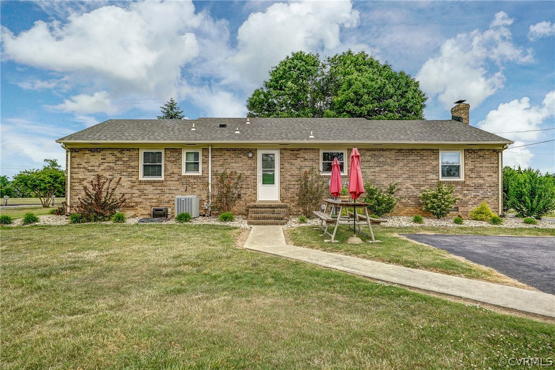 10601 River Road Chesterfield, VA 23838 - Photo 25 of 39 front view of house with a yard and potted plants
