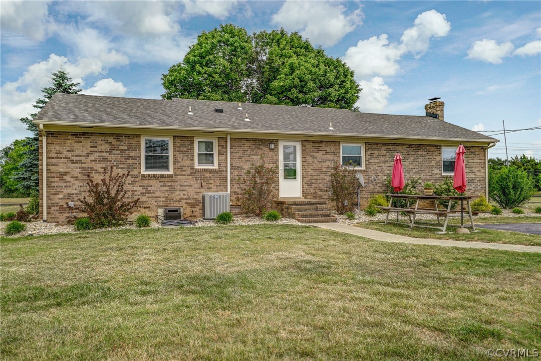 10601 River Road Chesterfield, VA 23838 - Photo 26 of 39 a front view of house with yard outdoor seating and barbeque oven