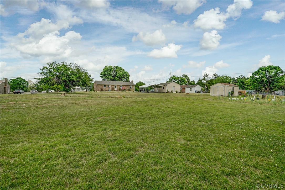 10601 River Road Chesterfield, VA 23838 - Photo 28 of 39 a view of a grassy field with an trees