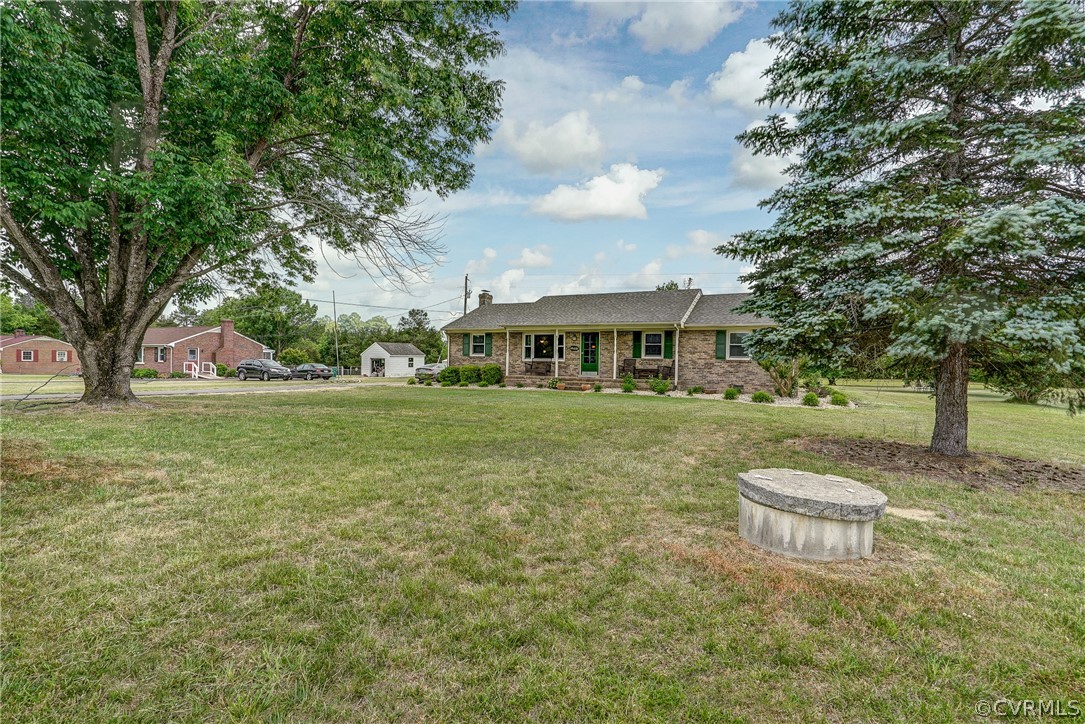 10601 River Road Chesterfield, VA 23838 - Photo 36 of 39 a front view of a house with a garden