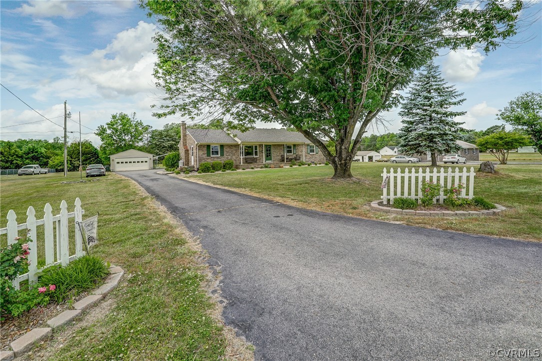 10601 River Road Chesterfield, VA 23838 - Photo 38 of 39 a front view of a house with a yard and shrubs