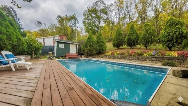 a view of swimming pool with lounge chair