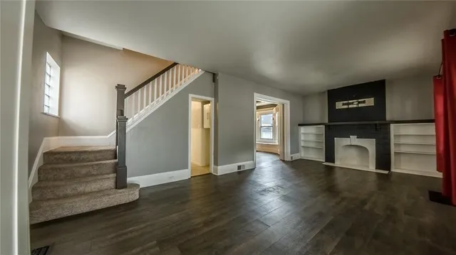 a view of an entryway with wooden floor