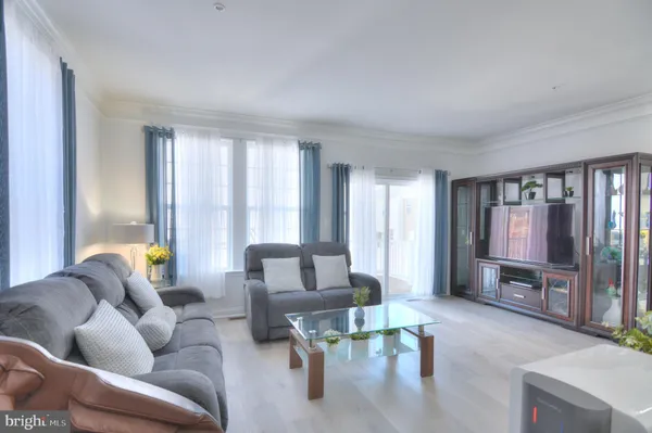 a kitchen with a sink a stove a refrigerator and cabinets