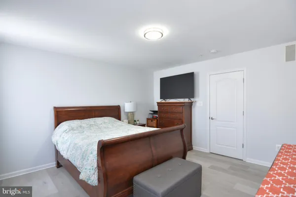 a bathroom with a double vanity sink toilet and shower