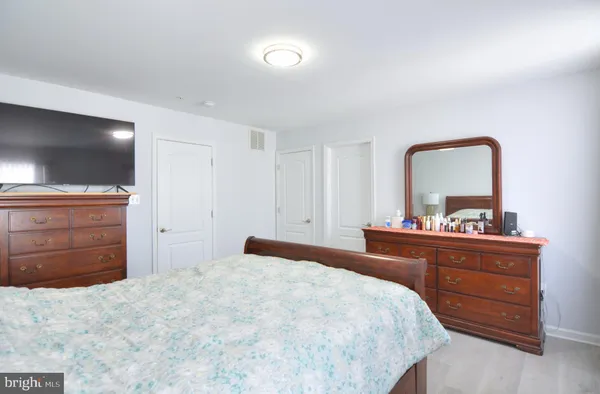 a bathroom with a sink vanity and mirror