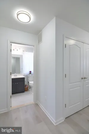 a bedroom with a bed and a mirror