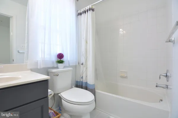 a bedroom with a bed and a mirror