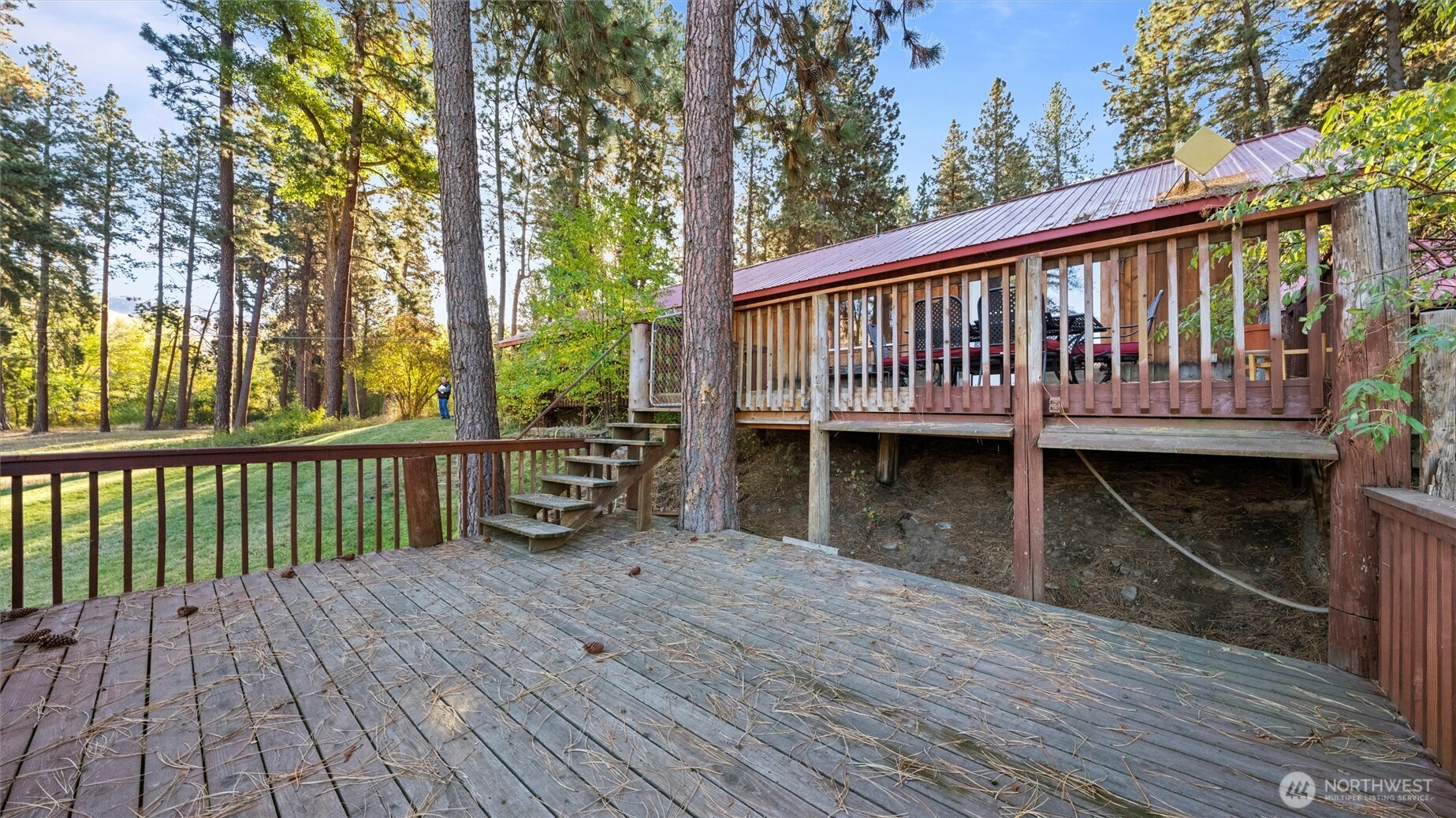 106 Wolf Ridge Lane Dayton, WA 99328 - Photo 7 of 39 a view of a wooden deck and a backyard