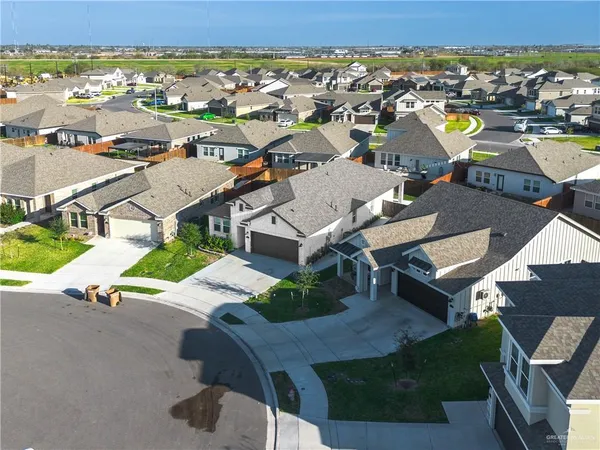 an aerial view of a house with a ocean view
