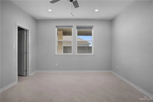 an empty room with a empty space and windows