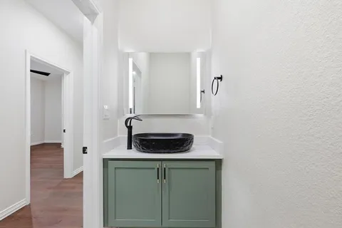 a bathroom with a bathtub and a sink