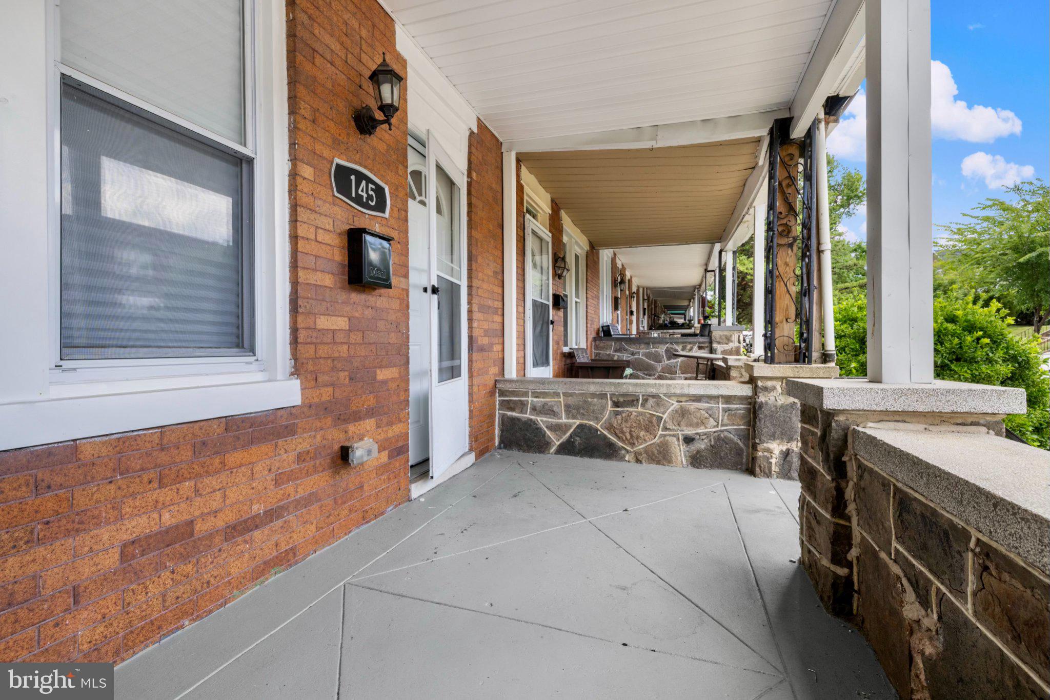 145 North Monastery Avenue Baltimore, MD 21229 - Photo 32 of 45 Charming porch with classic brick details.