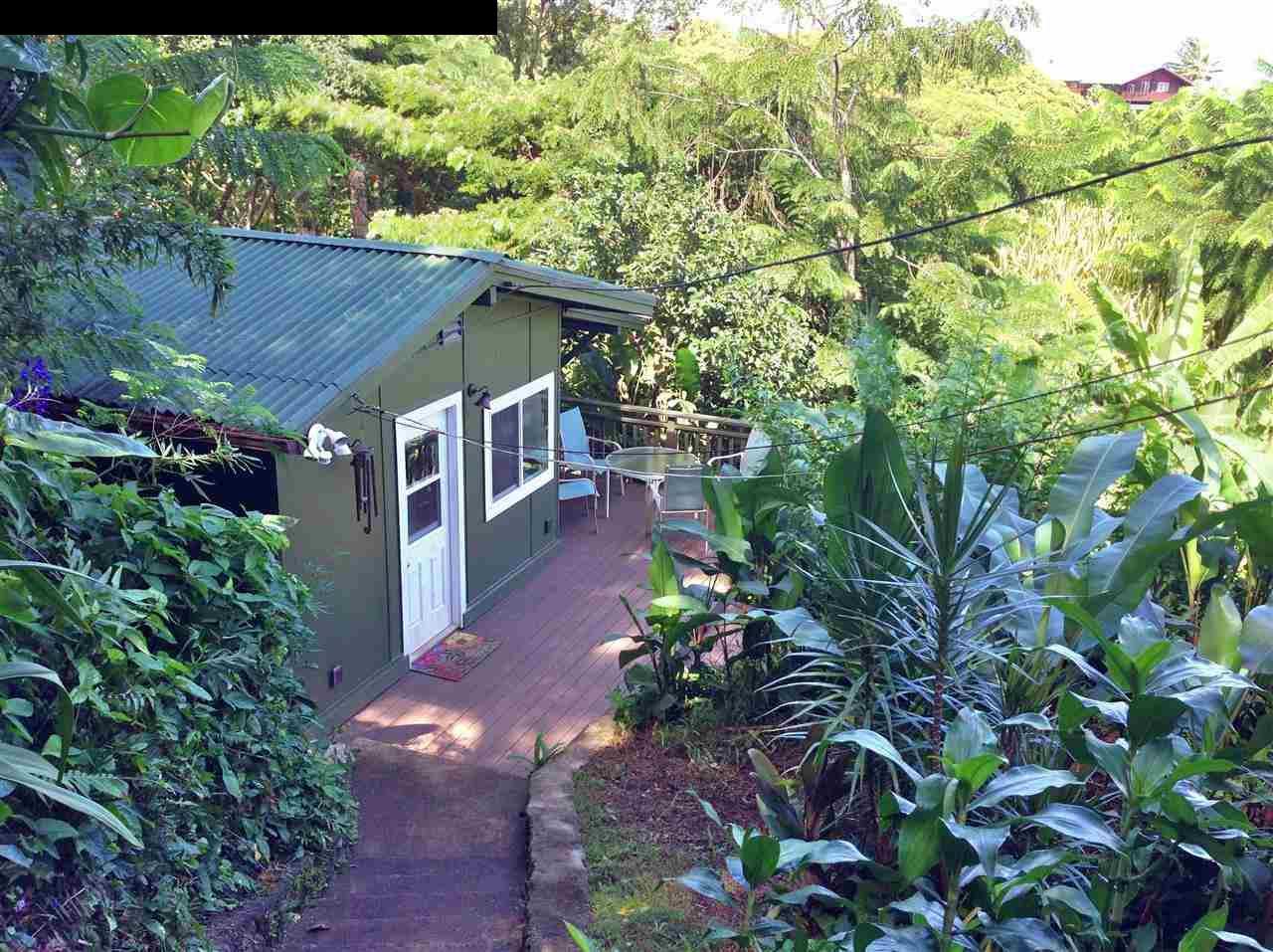 493 Kulike Road Haiku, HI 96708 - Photo 3 of 25 a view of a house with a yard