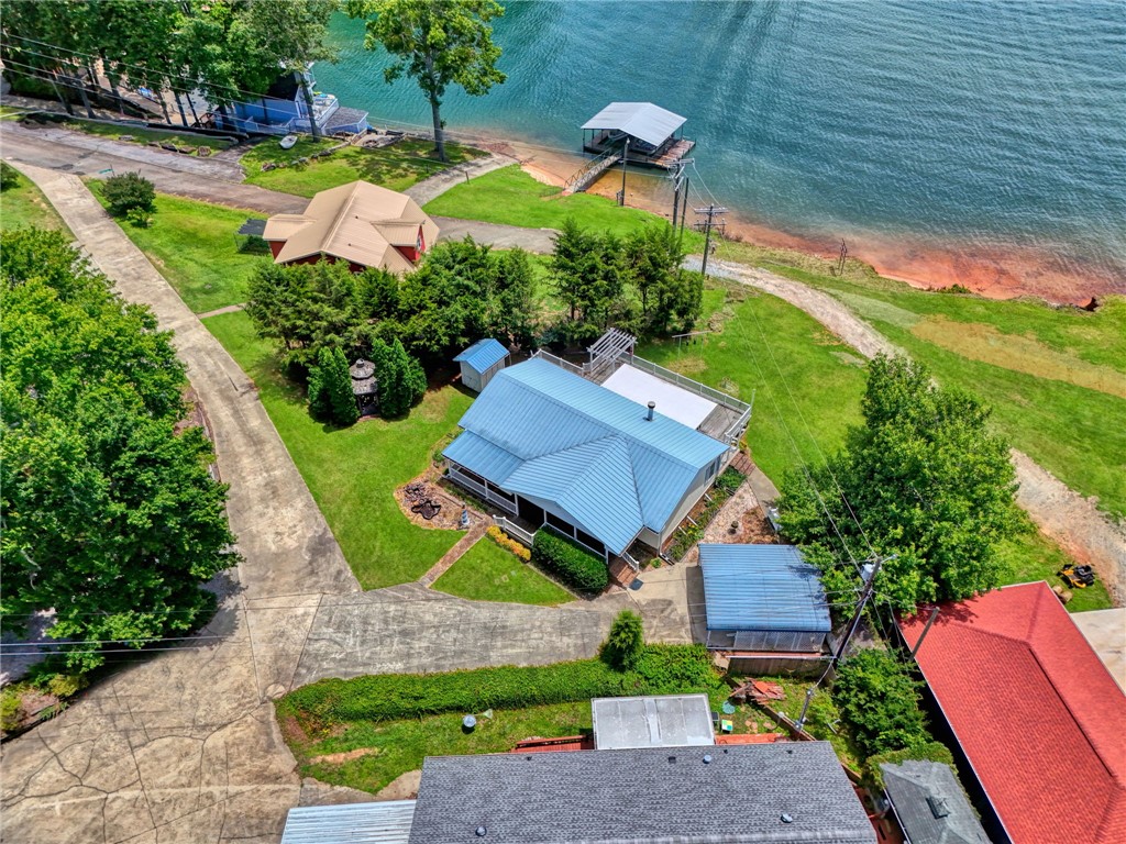 225 Nicholson Cove Road Seneca, SC 29672 - Photo 3 of 22 An aerial perspective reveals a serene lakefront property with a private dock and lush, well-maintained landscaping.