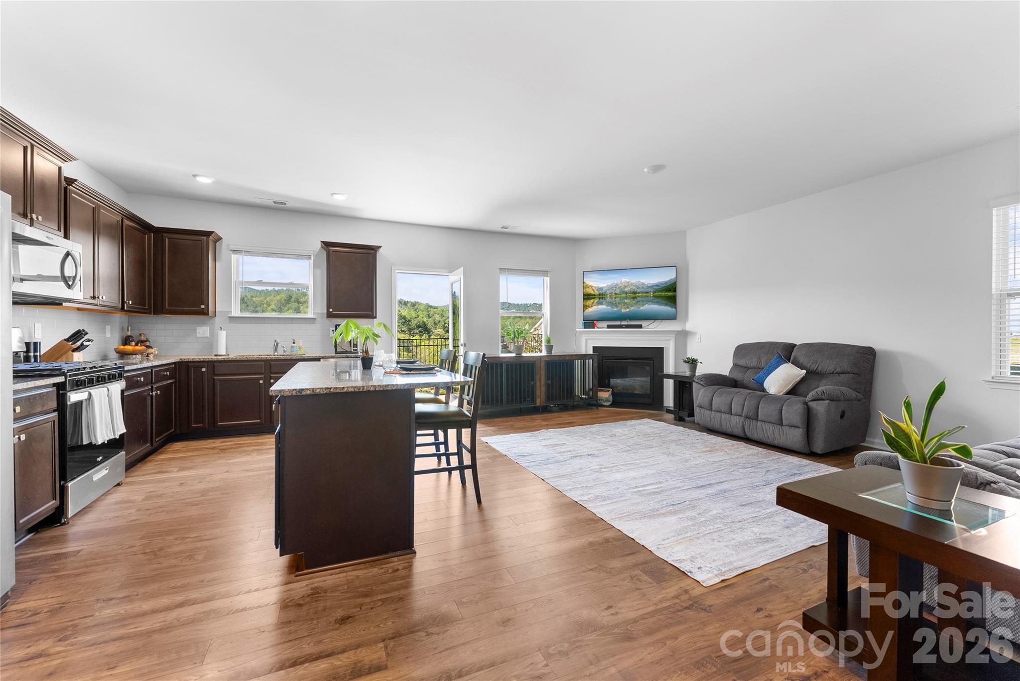 141 Amblers Knl Road Weaverville, NC 28787 - Photo 11 of 48 a living room with furniture wooden floor and kitchen view