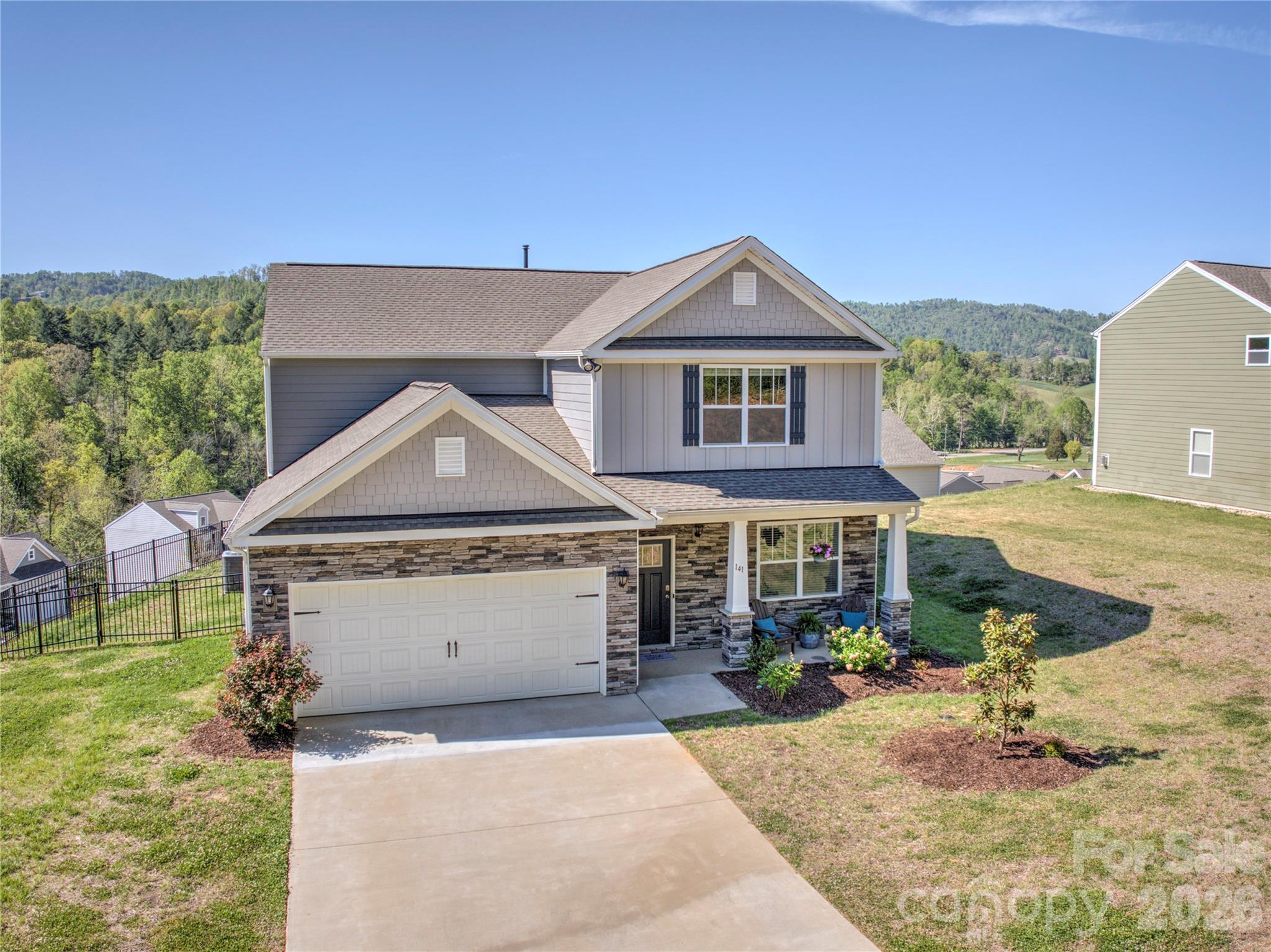 141 Amblers Knl Road Weaverville, NC 28787 - Photo 17 of 48 a front view of a house with garden