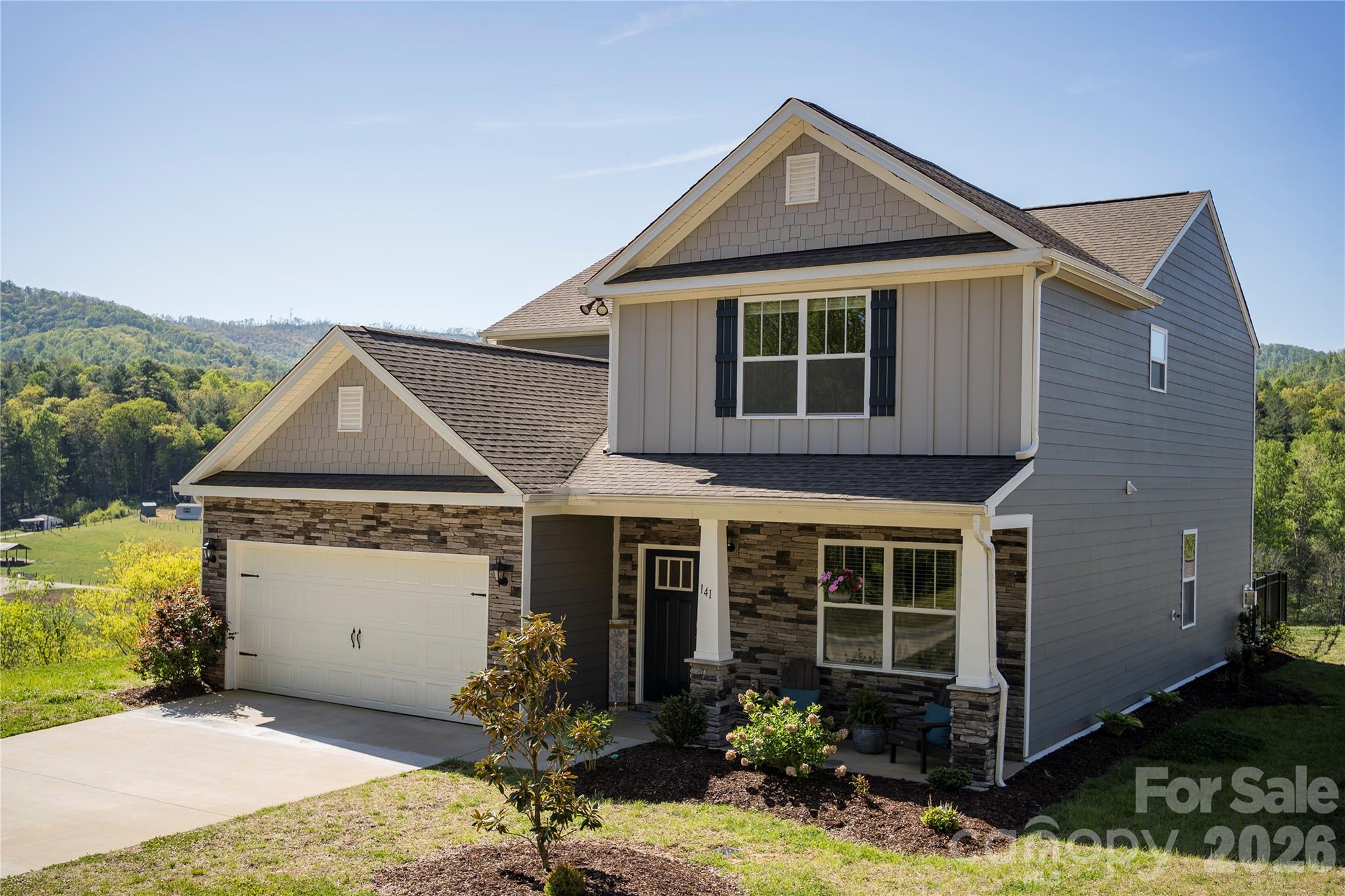 141 Amblers Knl Road Weaverville, NC 28787 - Photo 2 of 48 a front view of a house with garden