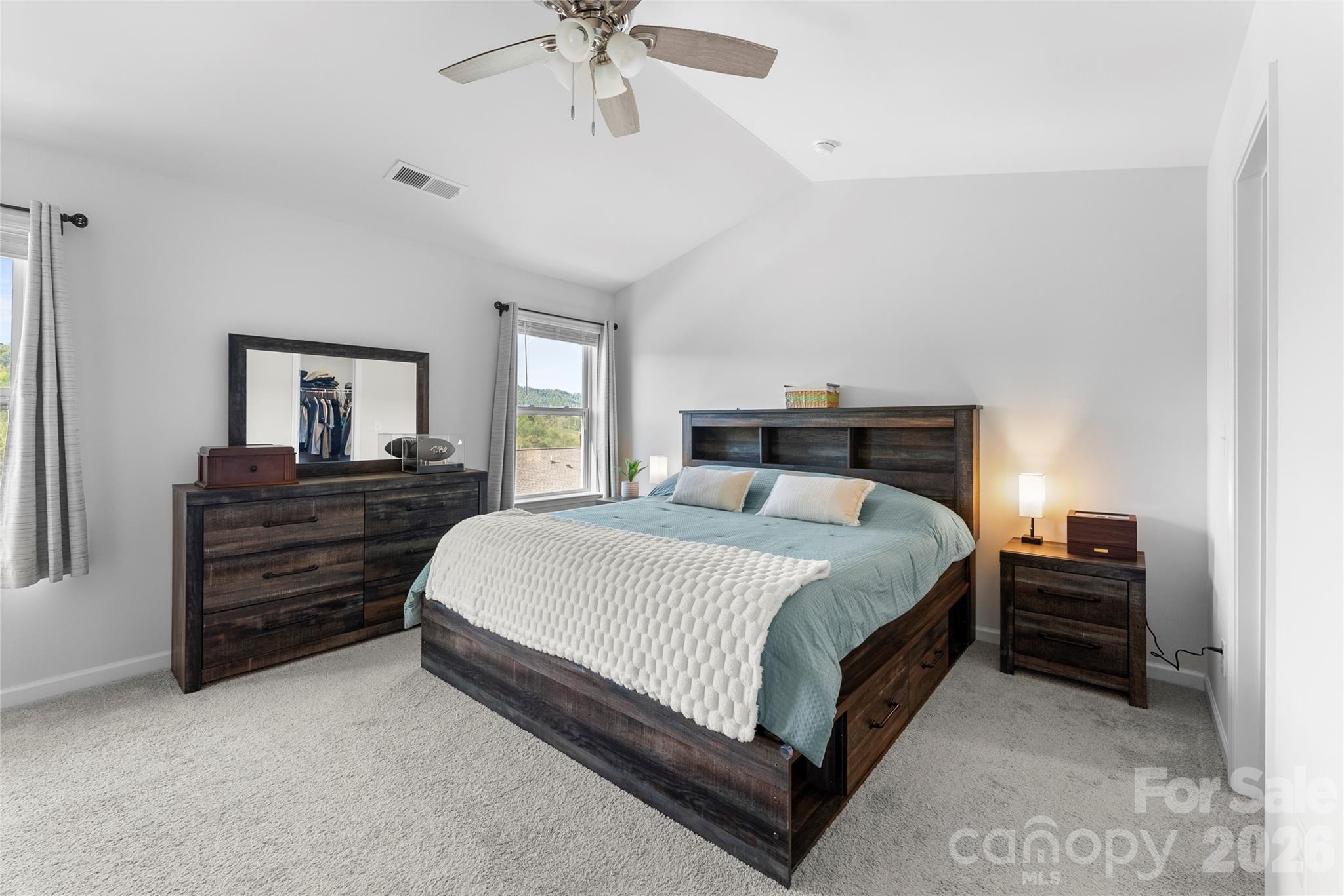 141 Amblers Knl Road Weaverville, NC 28787 - Photo 23 of 48 a bedroom with a bed and ceiling fan