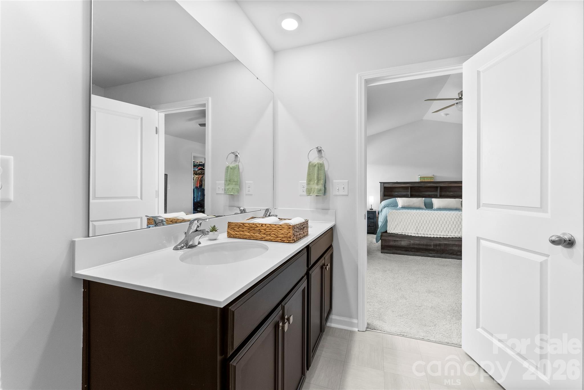 141 Amblers Knl Road Weaverville, NC 28787 - Photo 27 of 48 a en suite bathroom with a sink and a mirror