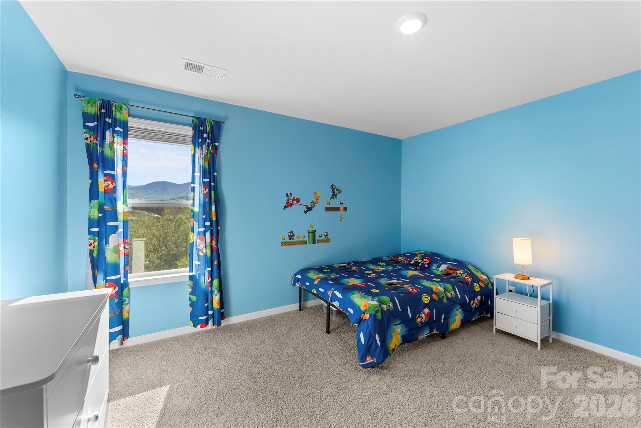 141 Amblers Knl Road Weaverville, NC 28787 - Photo 30 of 48 a bedroom with a bed and a window