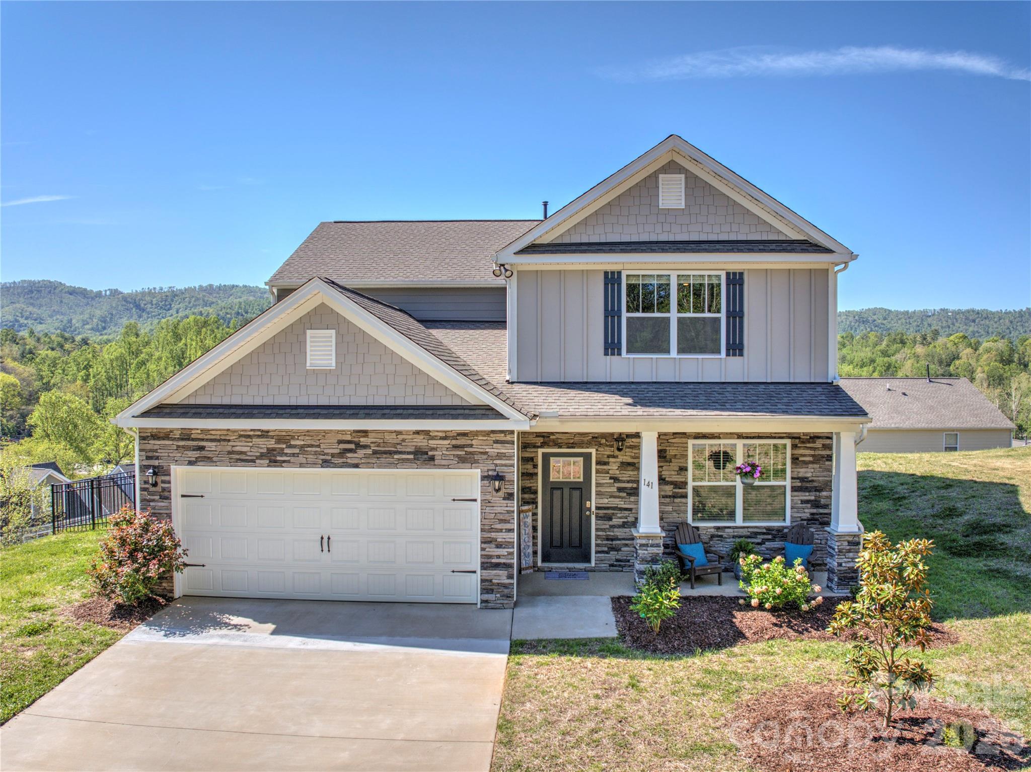 141 Amblers Knl Road Weaverville, NC 28787 - Photo 3 of 48 a front view of a house with a yard