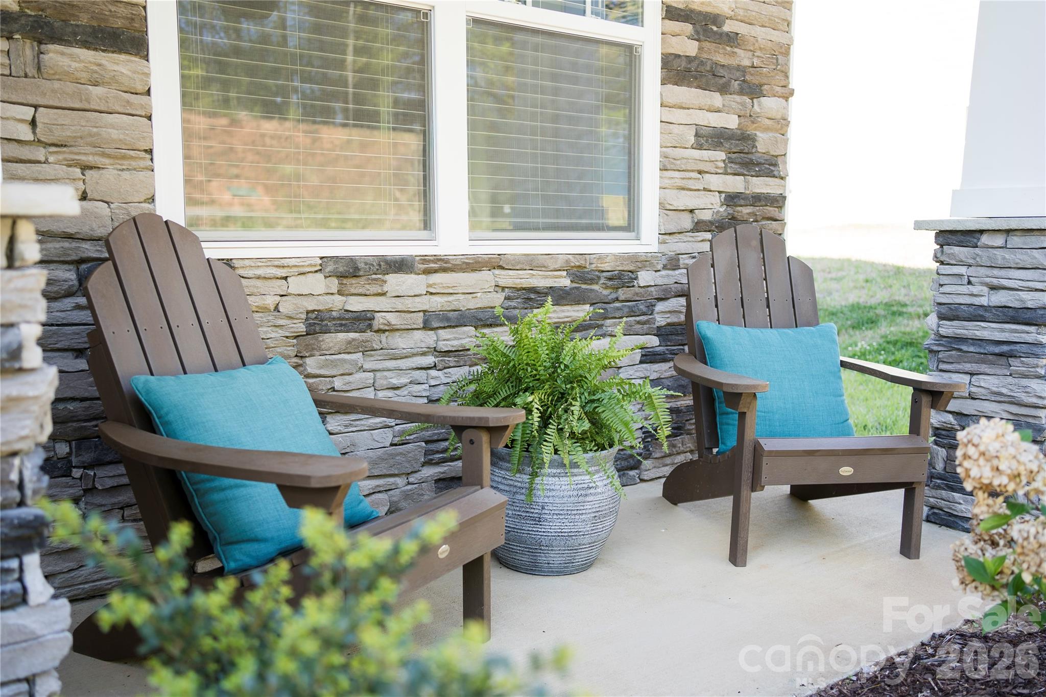141 Amblers Knl Road Weaverville, NC 28787 - Photo 4 of 48 a view of a chair and table in backyard
