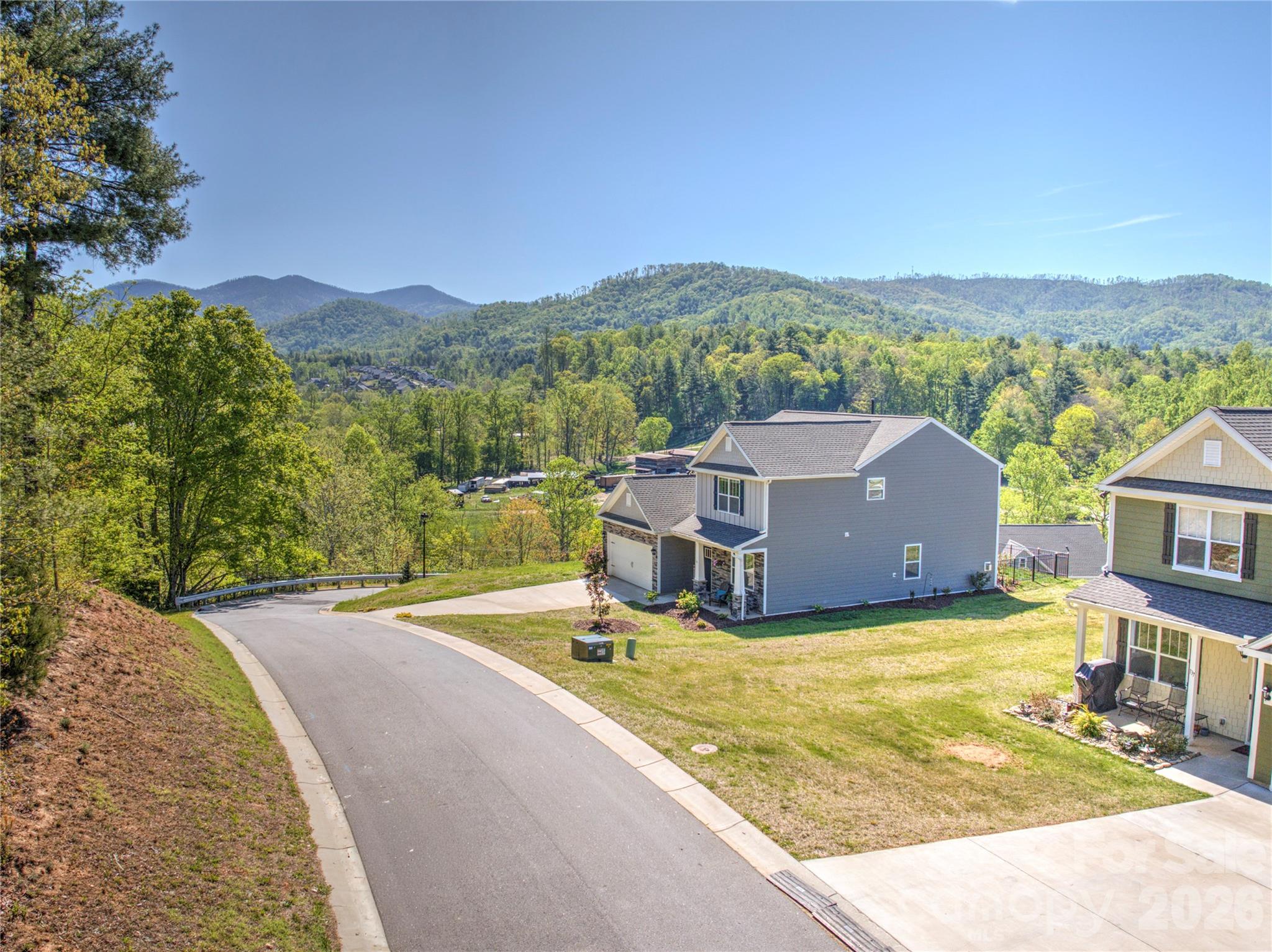 141 Amblers Knl Road Weaverville, NC 28787 - Photo 45 of 48 a view of a house with a yard and a large tree
