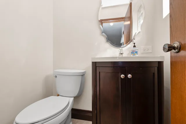 a bathroom with a toilet and sink
