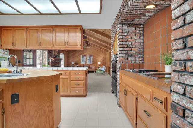 a kitchen with stainless steel appliances a stove and a refrigerator