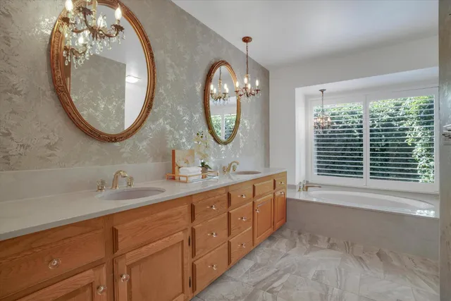 a bathroom with a double vanity sink and a mirror