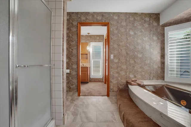 a bathroom with a bathtub and a sink