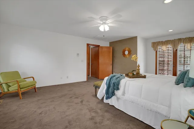 a bedroom with a bed and a couch