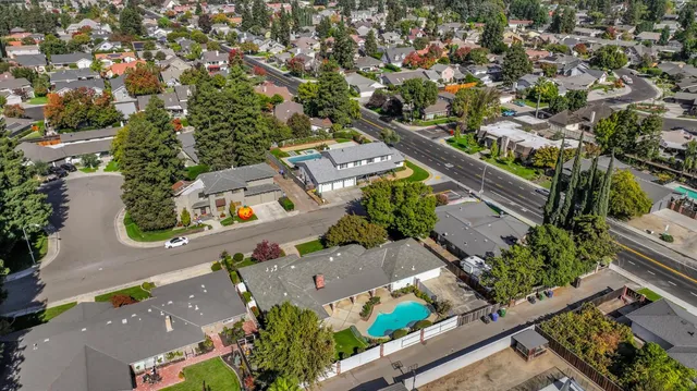 an aerial view of house with a yard