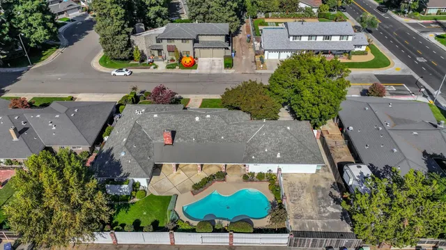 an aerial view of a house with a garden
