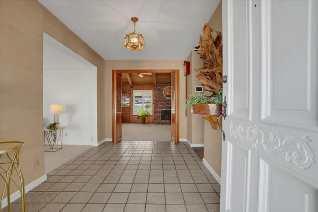 a view of hallway with wooden floor