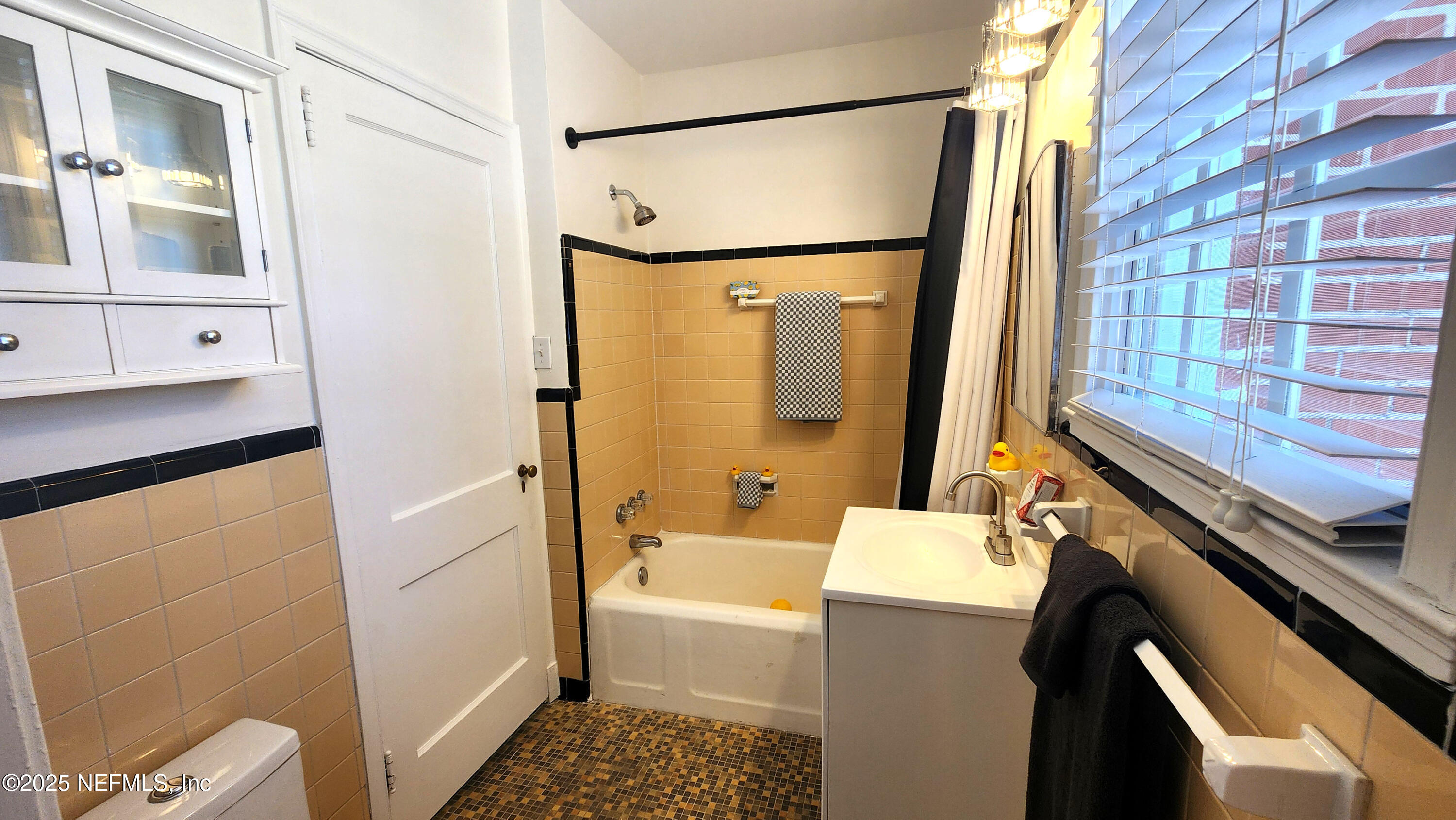 1418 Nicholson Road Jacksonville, FL 32207 - Photo 14 of 35 a bathroom with a sink a toilet and shower