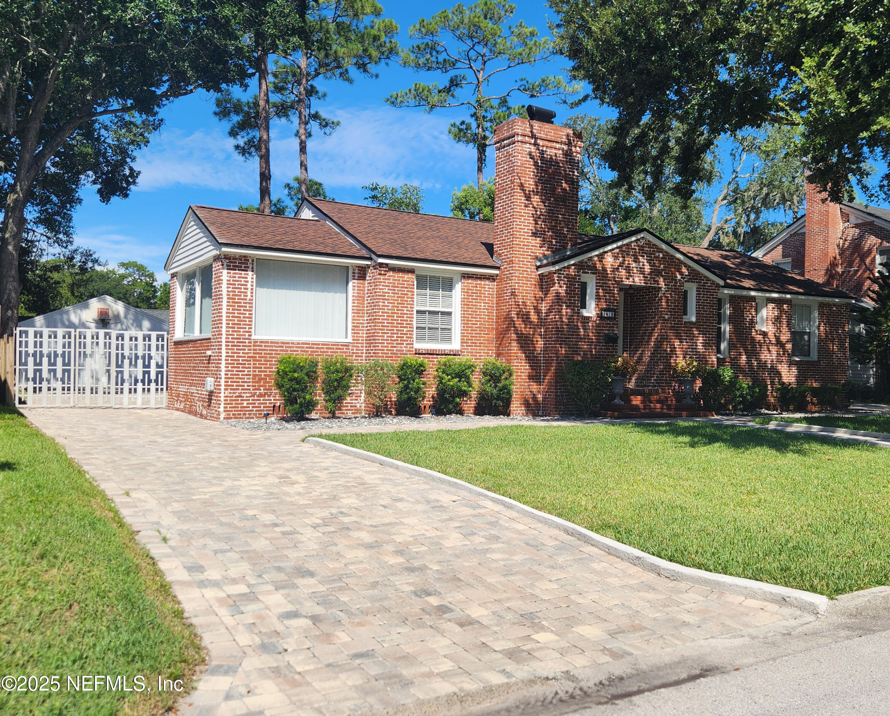 1418 Nicholson Road Jacksonville, FL 32207 - Photo 2 of 35 a front view of a house with garden
