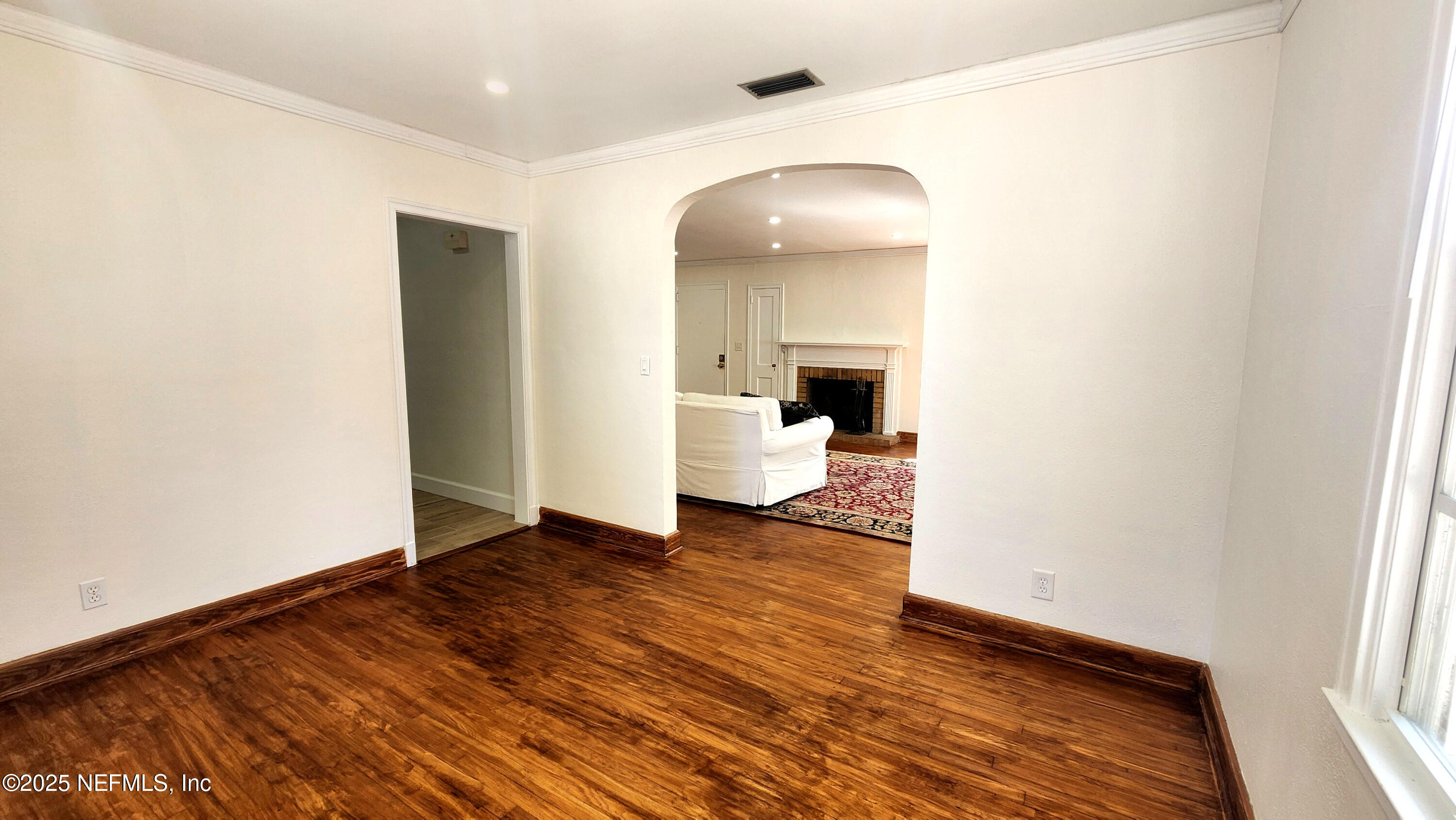 1418 Nicholson Road Jacksonville, FL 32207 - Photo 22 of 35 a view of a room with wooden floor and a toilet