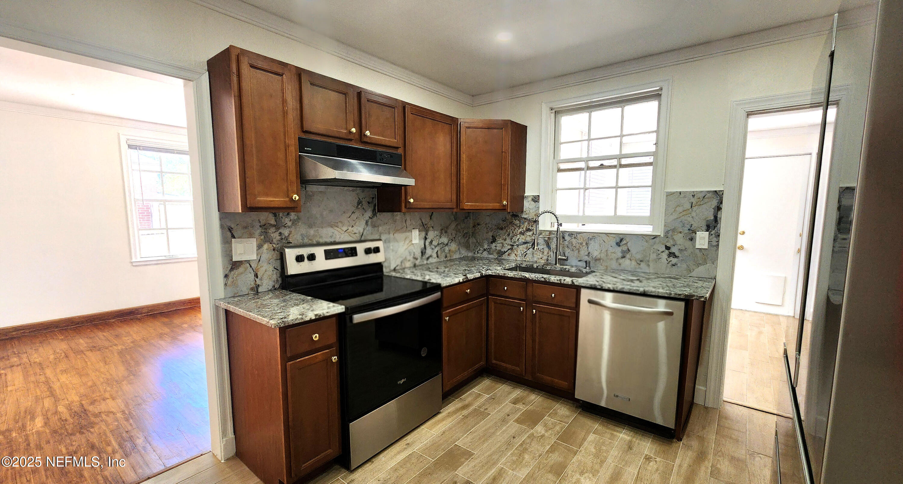 1418 Nicholson Road Jacksonville, FL 32207 - Photo 23 of 35 a kitchen with a sink stove and microwave